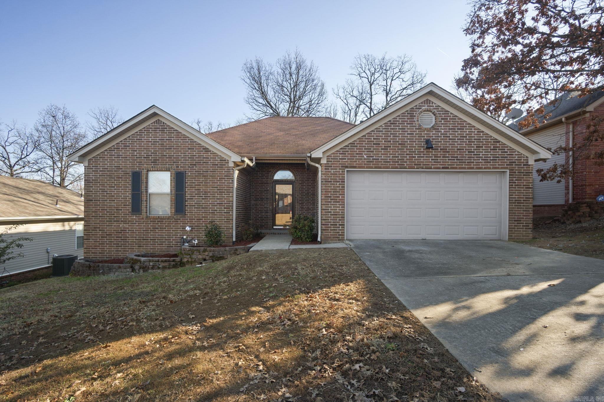 This beautifully updated home perfectly blends modern finishes and everyday convenience. It is located just minutes from shopping, dining, and schools.  Step inside to discover brand-new Luxury Vinyl Plank (LVP) flooring throughout, creating a sleek, low-maintenance environment. The living room features a cozy fireplace, perfect for relaxing with family or entertaining guests.   The heart of the home is the stunning kitchen, complete with elegant quartz countertops and modern fixtures that offer both style and functionality. Both bathrooms have been thoughtfully upgraded with new quartz countertops and stylish shower tile, providing a fresh, contemporary feel.  The master suite boasts dual walk-in closets for ample storage space. The two additional bedrooms also feature walk-in closets, ensuring plenty of room for your wardrobe.   Enjoy outdoor living in the fully fenced backyard. The newly updated deck offers a wonderful space for grilling, entertaining, or enjoying the outdoors.  This is a rare opportunity to own a turnkey home with all the upgrades and conveniences you desire. Don’t miss your chance to make this house your home!