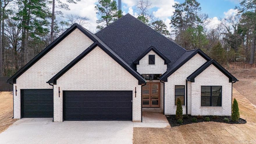 Welcome to 335 Arlington Park Drive, nestled in one of Hot Springs' most sought-after neighborhoods next to Hot Springs Country Club. This beautiful new construction 5-bedroom, 4.5 -bath home offers spacious living with modern comforts and classic charm. Step inside to a grand living area featuring 12 foot ceilings, with decorative wood beams that add warmth and character, perfect for both entertaining and relaxing. This home boasts 3445 sq feet of living space.