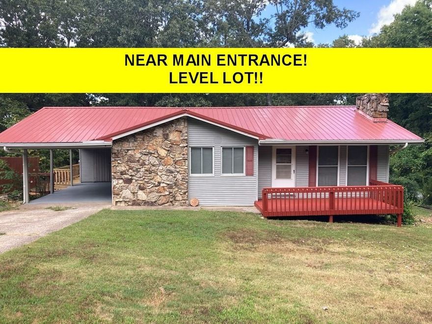 CLOSE TO MAIN ENTRANCE TO Cherokee Village on LEVEL LOT - NEW METAL ROOF in 2025!  2 Bedroom 2 Bath, big eat-in kitchen with a pantry that has lots of space!  Kitchen is open to the living room to cozy up to the gas log fireplace on those chilly winter nights. New walk-in shower & toilet in primary bedroom’s private bathroom plus a full bathroom, also with a new toilet, conveniently located to the guest bedroom. The new large back deck is perfect to have those summer BBQ’s overlooking the fenced in level back yard that has plenty of room for your kids or furry pets. Priced to sell at the REDUCED PRICE of $129,900. #2416