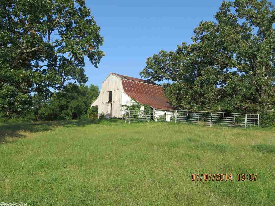 17+/- Acres with 700' of highway 10 frontage. All utilities available. 2 perfect building sites, pond for cattle grazing, fenced, and historic barn in need of some restoration.