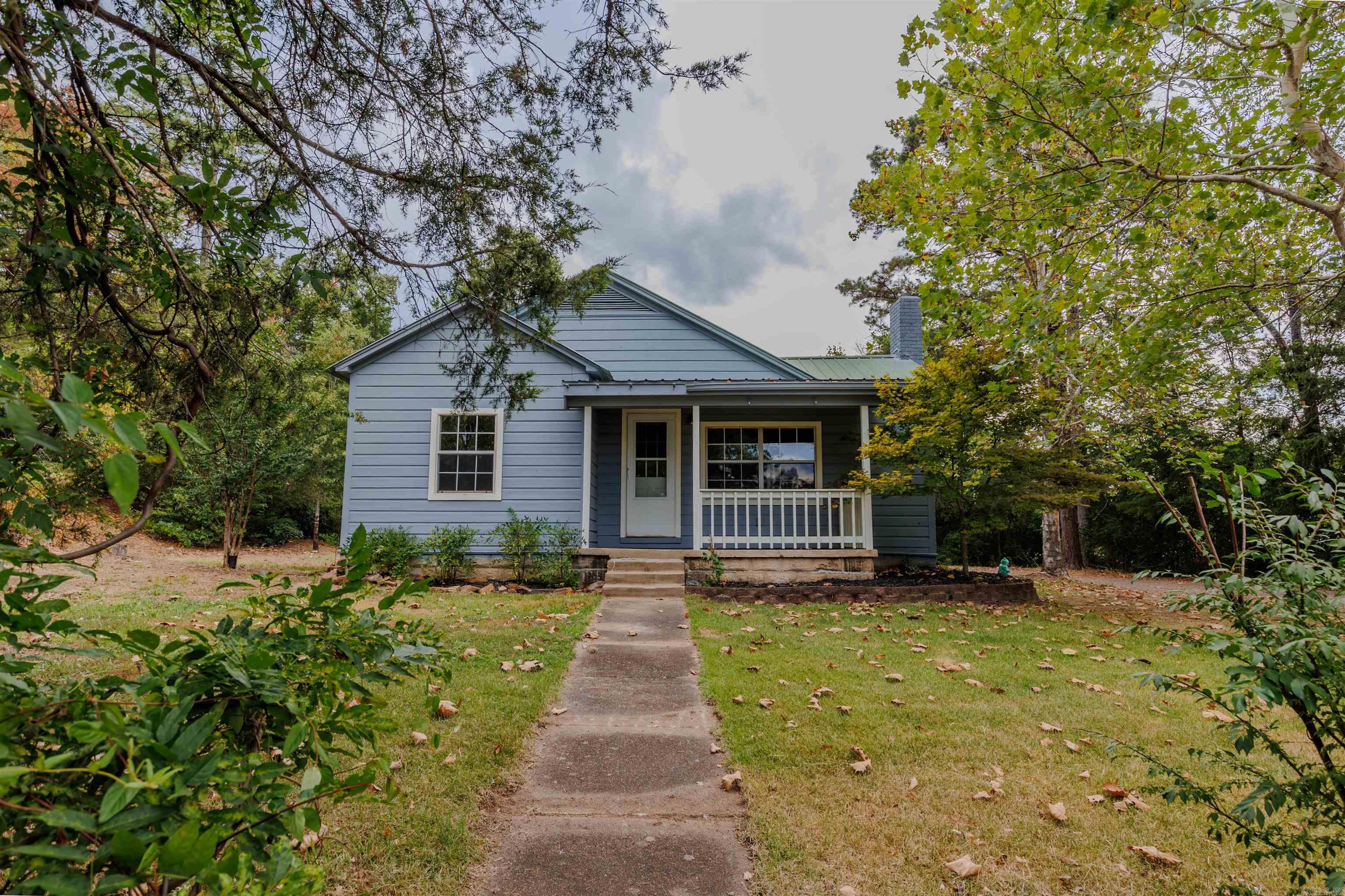This charming home is in the heart of Perryville, AR! It offers remarkable privacy, sitting on over 1 city acre! This home was purchased by the owner in 2004 and at that time was completely gutted and remodeled. There is a metal roof, new appliances, including a new water heater in 2024. The floors are ash hardwood. Connect2First offers fiber internet to this home. This property qualifies for USDA Rural Development 0% Down Payment Loans. Contact your preferred lender for qualification information. Don't miss out on this home!