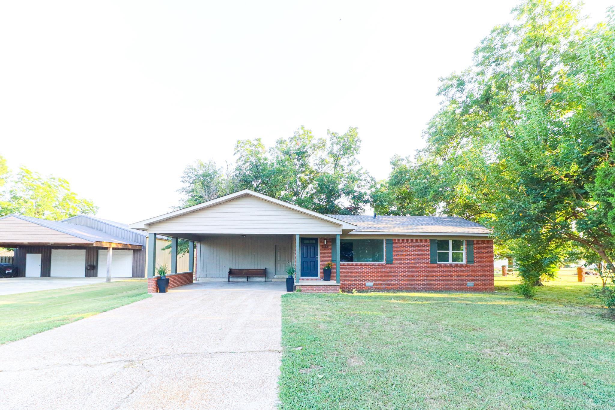 New home in older brick frame on large lot. This home has been completely remodeled down to the studs and some of those were replaced as needed. New Roof, Windows, Vinyl Siding, Central Heat and Air plus ductwork, electrical wiring, plumbing, flooring, sheetrock, painting, cabinets, hot water heater, insulation, appliances etc. The home also has an additional room on main level that could be a 3rd bedroom but it does not have a closet so we are calling it an office. The basement is approximately 150' with a closet and small windows. It would be considered a safe room/storage room. Very unique home in a tree shaded established neighborhood near downtown Walnut Ridge. Easy to show. Stainless Steel Prep Table in kitchen to remain.