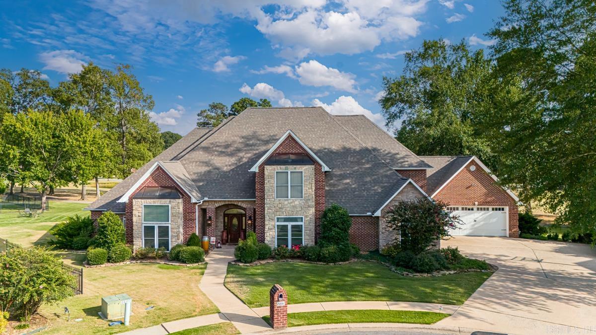 Welcome to your paradise on Longhills Golf Course – a freshly remodeled +4,600 sqft haven overlooking the scenic 11th hole. Downstairs blends luxury with functionality: A chef's kitchen features a wall oven and discreet fridge/freezer combo behind matching doors. Enjoy mornings in the breakfast nook, and entertain seamlessly in the dining room, living room, and kitchen flow. The primary suite boasts three walk-in closets and a spa-like bathroom. An office, laundry room, and versatile mudroom/home gym complete this level. Upstairs, three bedrooms each offer walk-in closets and private baths. Outside, the covered porch overlooks the golf course with a fire pit for perfect evenings. You can sleep soundly at night when the storms come and the power is out, because of the whole home generator already installed. This home offers luxury, comfort, and effortless living – schedule your tour today and discover life on Longhills Golf Course at its finest!