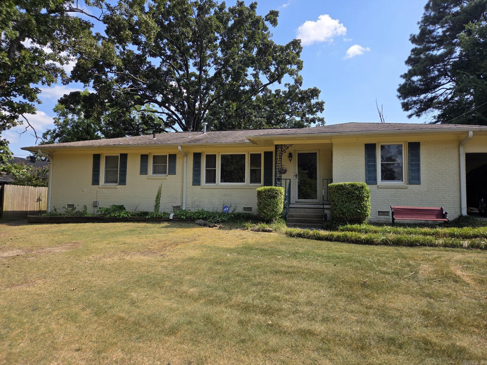 Nice 3 bedroom, 2 bath brick house with fenced in back yard & 2 storage buildings. One storage was recently put in at a $6,000 cost. Updates include NEW air unit in 2025, new water heater in 2019, replumbed underneath house a few years ago, updated vinyl windows installed, hand scrapped hardwood flooring throughout except bathrooms, gutters & storm doors. Hugh living room with large picture window, 2nd living area can be used as bonus, game, 4th bedroom or craft room & office combo. Large separate laundry with storage with additional storage & mini shop behind the carport. Appointment only, see agent remarks.