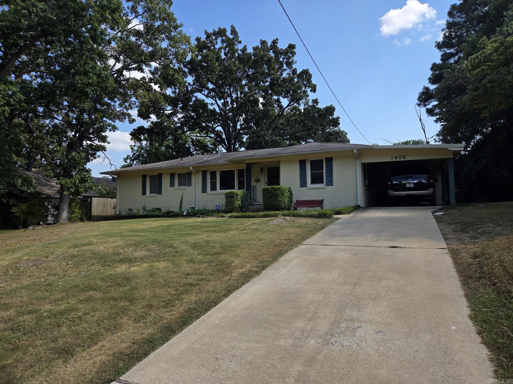 Nice 3 bedroom, 2 bath brick house with fenced in back yard & 2 storage buildings. One storage was recently put in at a $6,000 cost. Updates include NEW air unit in 2025, new water heater in 2019, replumbed underneath house a few years ago, updated vinyl windows installed, hand scrapped hardwood flooring throughout except bathrooms, gutters & storm doors. Hugh living room with large picture window, 2nd living area can be used as bonus, game, 4th bedroom or craft room & office combo. Large separate laundry with storage with additional storage & mini shop behind the carport. Appointment only, see agent remarks.