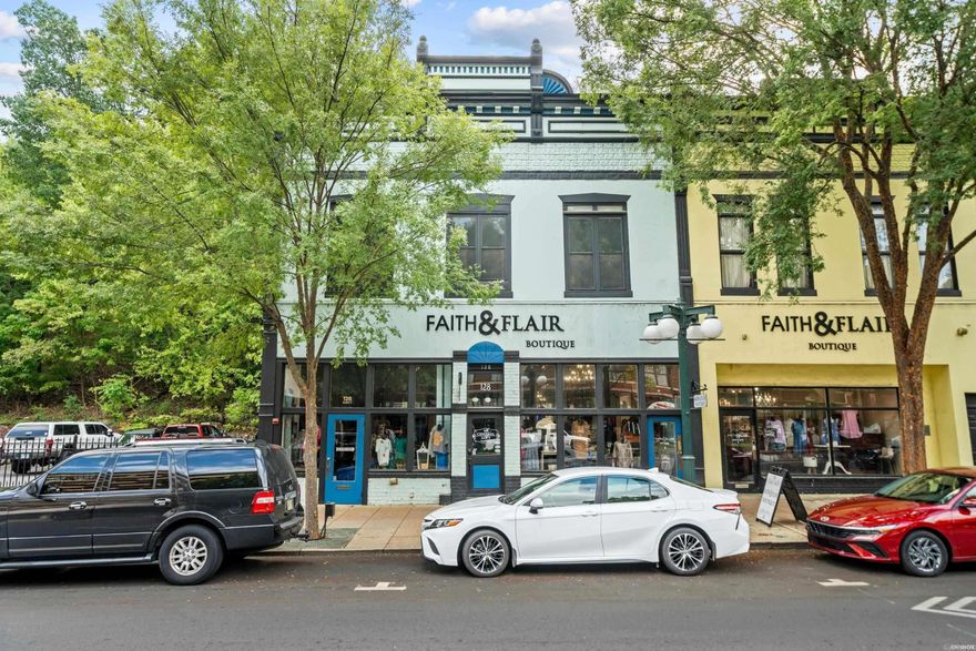 Very rare opportunity to purchase a fully renovated historic building in the heart of downtown Hot Springs.  Built in 1891, this building is an iconic landmark with its 100+ year old mural facing Central Avenue.  The ground floor retail space is beautifully preserved with high ceilings, original brick walls and wood floors. The 2BR/2.5BA apartment on the second level is a showplace!  The space has been remodeled to the highest standards and recently upgraded with a new fire suppression system.  The tasteful furnishings and design of the space, coupled with its location, has made it one of the most popular short term rentals in the downtown area.  The unit is being sold fully furnished, with all contents conveying to the new buyer.  This building is one of the finest examples of historic preservation in downtown Hot Springs.