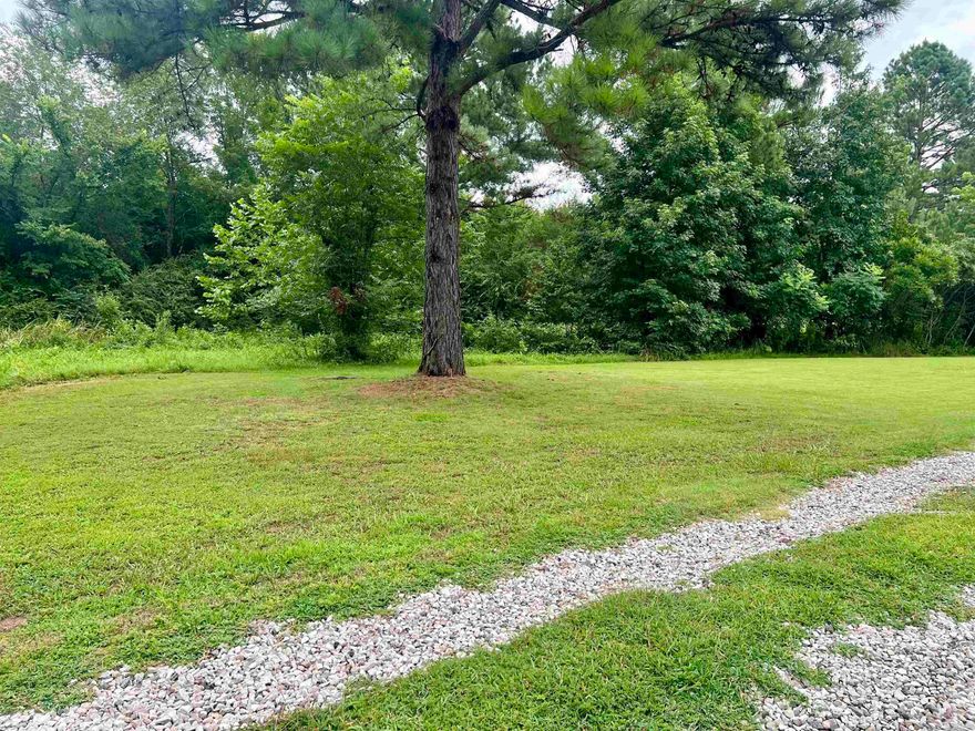 .83 acre tract with septic, water meter in place. Gas and electric available for connection. No mobiles, mineral rights do not convey. 1200 sq ft minimum build deed restriction.