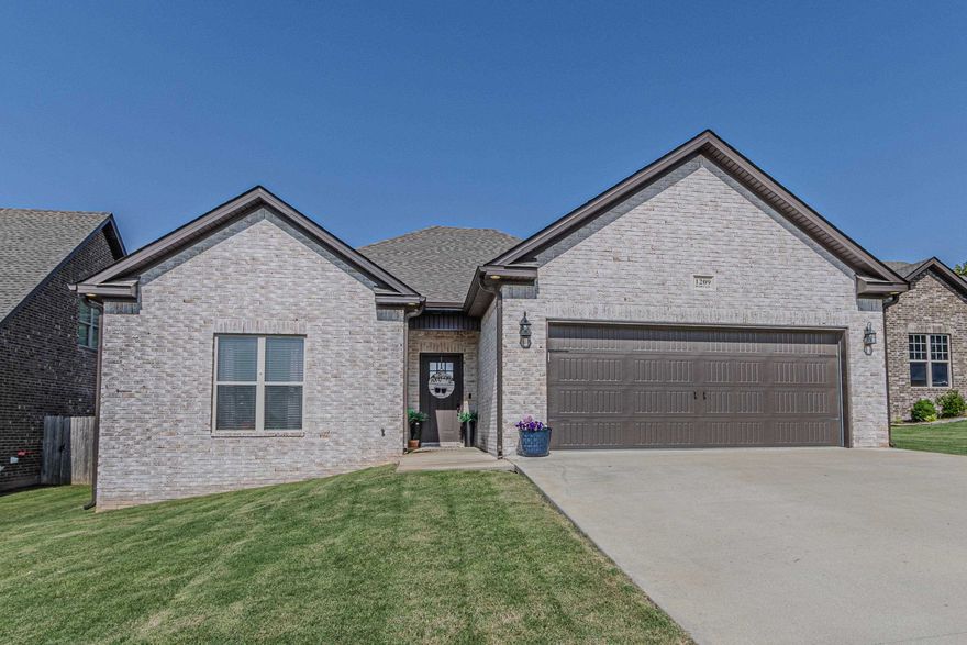 Welcome to this all brick newer construction home offering the perfect blend of modern style and everyday comfort! With approximately 1,750 sq ft, this 3-bedroom, 2-bath home features an inviting open floor plan designed for both entertaining and relaxed living.  The heart of the home is the beautiful kitchen, complete with a large granite island, sleek finishes, and ample cabinet space. The spacious living room and dining area flow seamlessly together, creating a light and airy space filled with natural light.  Enjoy privacy with the split floor plan, and unwind in the primary suite featuring a freestanding soaking tub, tile shower, and generous closet space.  Step outside to your screened-in back porch—perfect for morning coffee or evening relaxation—and a fenced-in backyard ideal for pets, kids, or backyard gatherings.  Located in a prime location close to everything you need, this home also boasts beautiful modern accents throughout that add just the right touch of style.  Don't miss your chance to make this gorgeous home yours!