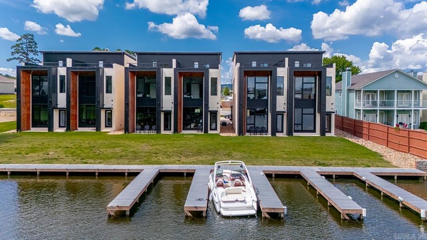 Enjoy luxury living in Lake Hamiltons newest Rooftop Townhomes. With modern design and high end finishings these fully furnished townhomes are guaranteed to impress! Outside of city limits but only minutes to all amenities Hot Springs, AR has to offer. Souring 10-12' ceilings with oversized windows give a bright and airy feel. Short-term rentals allowed, or keep for your own personal or corporate getaway. Extra sound insulation in between units for increased comfort and privacy. Buy one unit or up to 6 units, and plans/specs available for 8 more units. First come first serve on available boat slips for purchase.