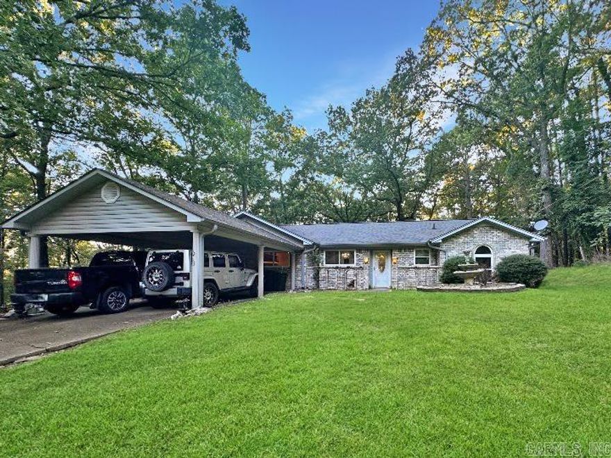 Tucked away at the end of a quiet street this property offers plenty of privacy  surrounded by trees which brings the opportunity to enjoy the wildlife. Step inside to a warm and inviting layout featuring a formal dining room, vaulted ceilings and new modern insulated windows. Just minutes from all the conveniences of town and the Caddo River.