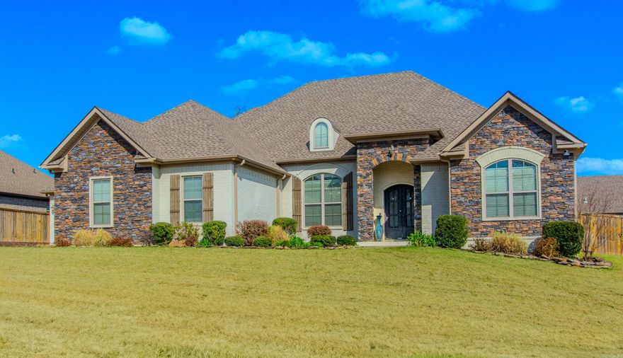 WELCOME to this stunning home sitting on a large 1/2 acre corner lot in Miller Heights! The main floor features beautiful wood flooring throughout, high ceilings and elegant trim work. You will love the open floor plan, which is perfect for hosting large family gatherings! The beautiful kitchen is equipped with lots of cabinetry, a gas cooktop, walk in pantry and large granite island!  The impressive master suite includes a spa bath with a soaking tub, large walk in shower, separate vanities, and a fabulous walk through closet! Additionally, two bedrooms share a Jack-n-Jill bathroom, perfect for kiddos!  This home offers many features, including a three car garage with a certified safe room, a mudroom a large laundry room and a screened in back porch!  The layout includes five bedrooms, four of which are located downstairs with 2 1/2 baths. The upstairs space serves as fifth bedroom, bonus room or media room and includes a full bathroom and closet. Come see today!