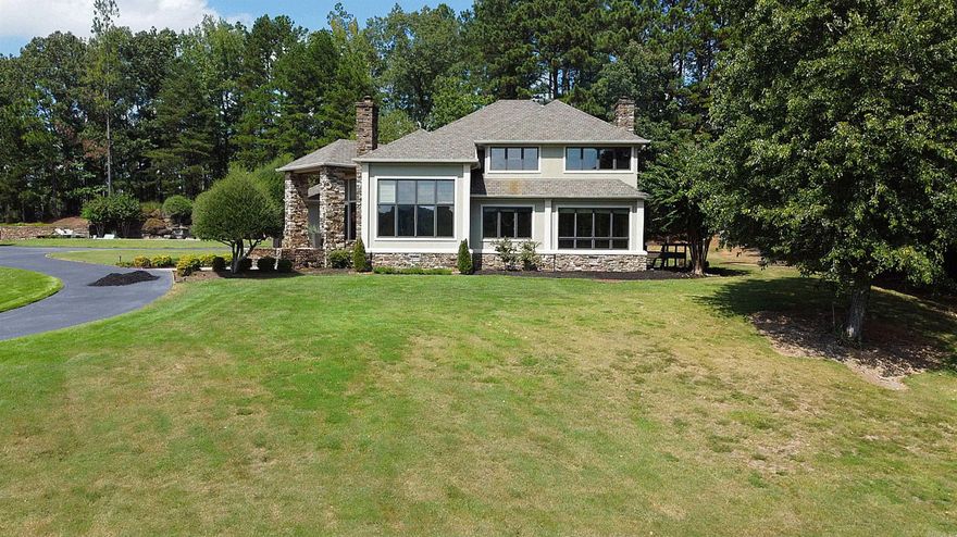 DRAMATIC SETTING and street appeal in the custom built home! Vista view to greet your guests at your gated driveway and front porch. Gorgeous stone fireplaces and stone entrance lead you to the curved staircase and Hickory hardwood flooring upstairs! Dream kitchen with a bright breakfast room, Hearth Room, Sun Room, huge windows everywhere! Updates throughout, Brand New HVAC units. Shared gate and driveway to a huge side parking area and 3 car garage. Large private back deck! Contemporary look and colors! Huge Primary suite with an office/sitting room overlooking the grounds! Private back patio for entertaining!