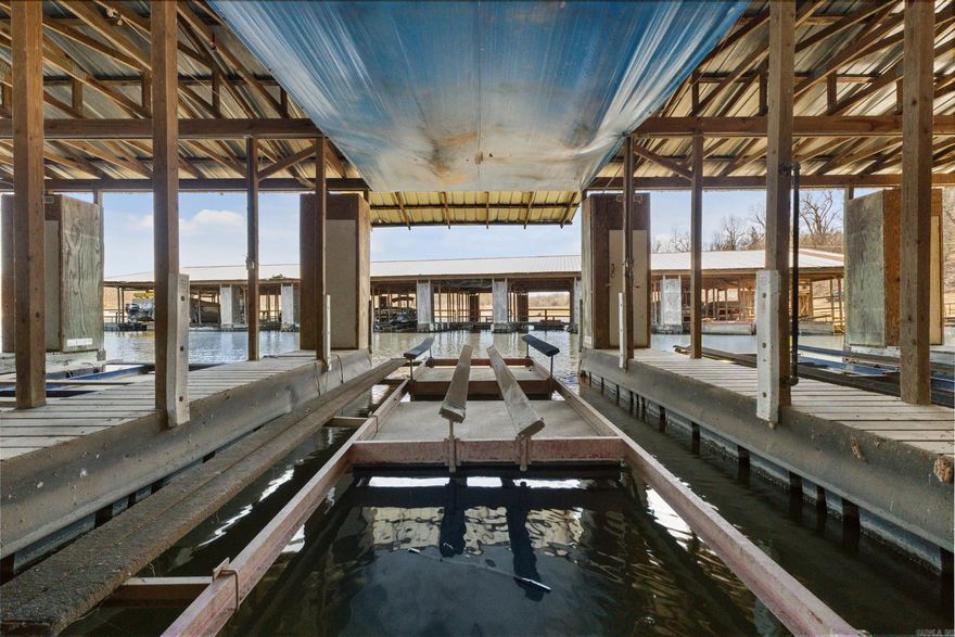 Norfork Lake Boat Slip available at Walker's Branch Dock. Includes a hydraulic lift and storage locker. 10x24 slip with extended roof cover.