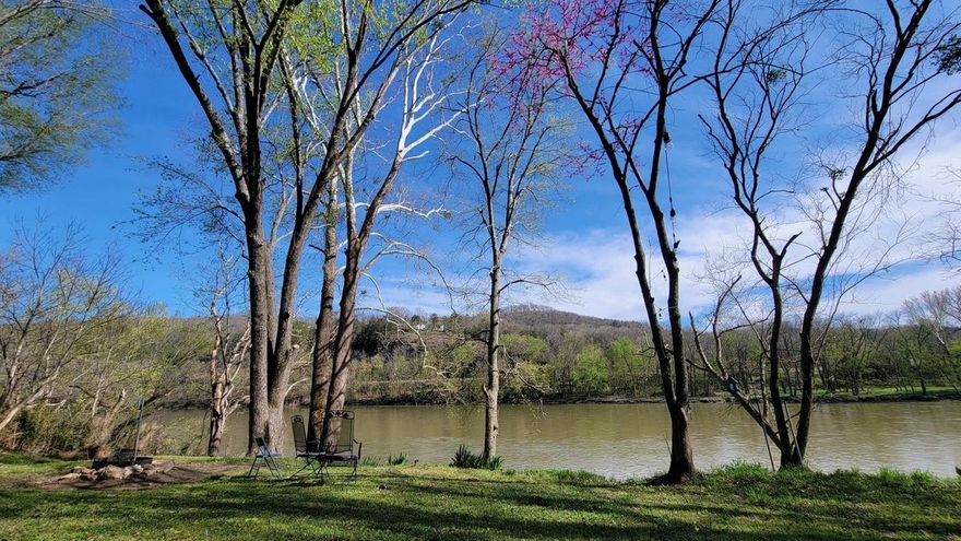 Positioned along the White River, this 4-bedroom, 2-bath property offers a layout designed for versatility. With identical upper and lower levels (2 bedrooms / 1 bath each), the home can function as a single large river retreat — or be configured into two separate rental spaces for diversified income potential.  The walk-out lower level includes its own living area and kitchenette, making it ideal for dual occupancy, extended-stay guests, or short-term rental flexibility. Simply secure the interior stair access and designate outdoor river space accordingly — or keep it open to accommodate larger groups.  Set on approximately 0.70 acres with river frontage, paved access, and no HOA, the property blends natural setting with accessibility. Whether used as a multi-unit rental strategy, seasonal getaway, or income-producing river asset, the structure supports multiple approaches.  Currently operating as a short-term rental. So many options for the next owner to personalize, reposition, or optimize for their specific investment model.