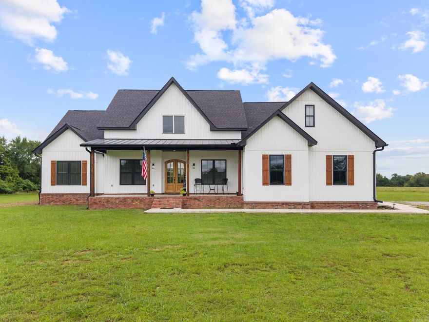 This beautiful 3,294 sq ft custom home, built in 2023, sits on 9.83 acres and blends modern design with country living.  Inside, you'll find 4 spacious bedrooms, 3.5 bathrooms, and an upstairs bonus suite complete with it's own full bath and closet- perfect as a 5th bedroom, guest space, or private retreat.  Luxury vinyl plank flooring flows throughout, while the open layout highlights a bright, inviting living area.  The  kitchen features granite countertops, a gas range with convection oven, walk-in pantry, and generous cabinetry.  Enjoy evenings on the covered back patio that includes a gas outlet with hot and cold connections for an outdoor kitchen!  There is an additional adjoining 10 acres that may be purchased for an additional price if more land is desired. Don't miss this gem!!