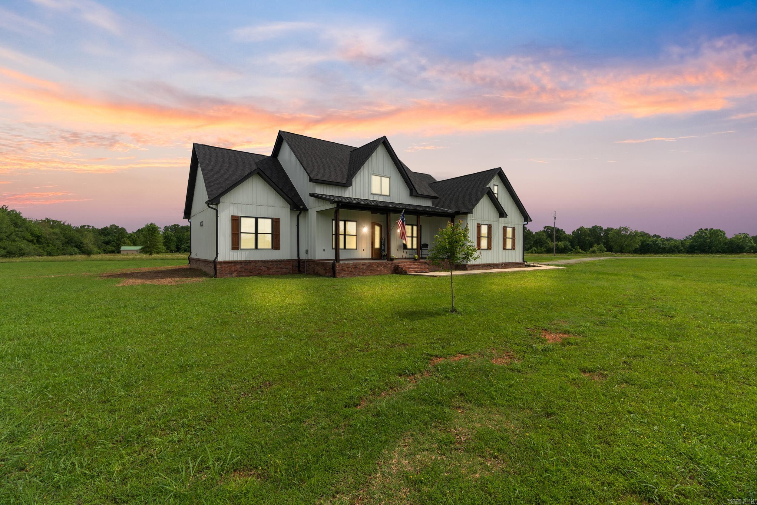 This beautiful 3,294 sq ft custom home, built in 2023, sits on 9.83 acres and blends modern design with country living. Inside, you'll find 4 spacious bedrooms, 3.5 bathrooms, and an upstairs bonus suite complete with it's own full bath and closet- perfect as a 5th bedroom, guest space, or private retreat. Luxury vinyl plank flooring flows throughout, while the open layout highlights a bright, inviting living area. The kitchen features granite countertops, a gas range with convection oven, walk-in pantry, and generous cabinetry. Enjoy evenings on the covered back patio that includes a gas outlet with hot and cold connections for an outdoor kitchen! There is an additional adjoining 10 acres that may be purchased for an additional price if more land is desired. Don't miss this gem!!