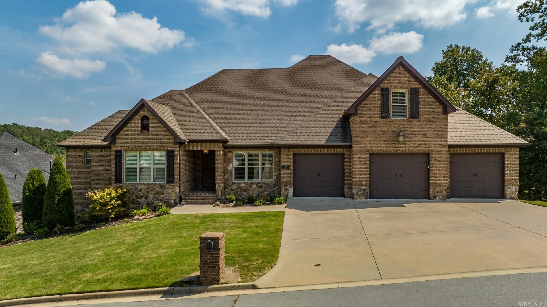 Welcome to this stunning Woodlands Edge home that lives like a one level!   All 4 bedrooms and 3 1/2 baths are downstairs. Spacious bonus room and walk-in attics are upstairs.   The gorgeous property features custom trim work, plantation shutters, site finished hardwoods, chef's kitchen, incredible storage, and treehouse views. Other notable highlights include large laundry room and pantry, covered deck, tankless water heater, and under house storage. The peaceful greenbelt on side and back of the home is maintained by the HOA.  Don't miss the neighborhood walking trails, park, pool and greenspaces!  Agents, please see remarks.