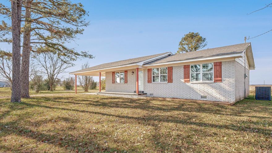 This exquisite completely remodeled 3-bedroom, 2-bath Brick home with 2-car garage. This house has new kitchen cabinets and appliances. House is very open with a large dining and living room., This house has all new upgraded flooring through-out the house. Indulge in the luxury of the owner's tranquil sanctuary to unwind in the nearly 1-acre, with shade trees. This house has all new plumbing, a new roof, new water heater and the wiring was updated. Through-out the house you will see all new lighting, and both bathrooms have been totally updated. This is an energy efficient home with central heating and air. Has a large back patio with roof. There is also a 20 x 30 out-building . Don't let this exceptional opportunity slip away from your viewing today!