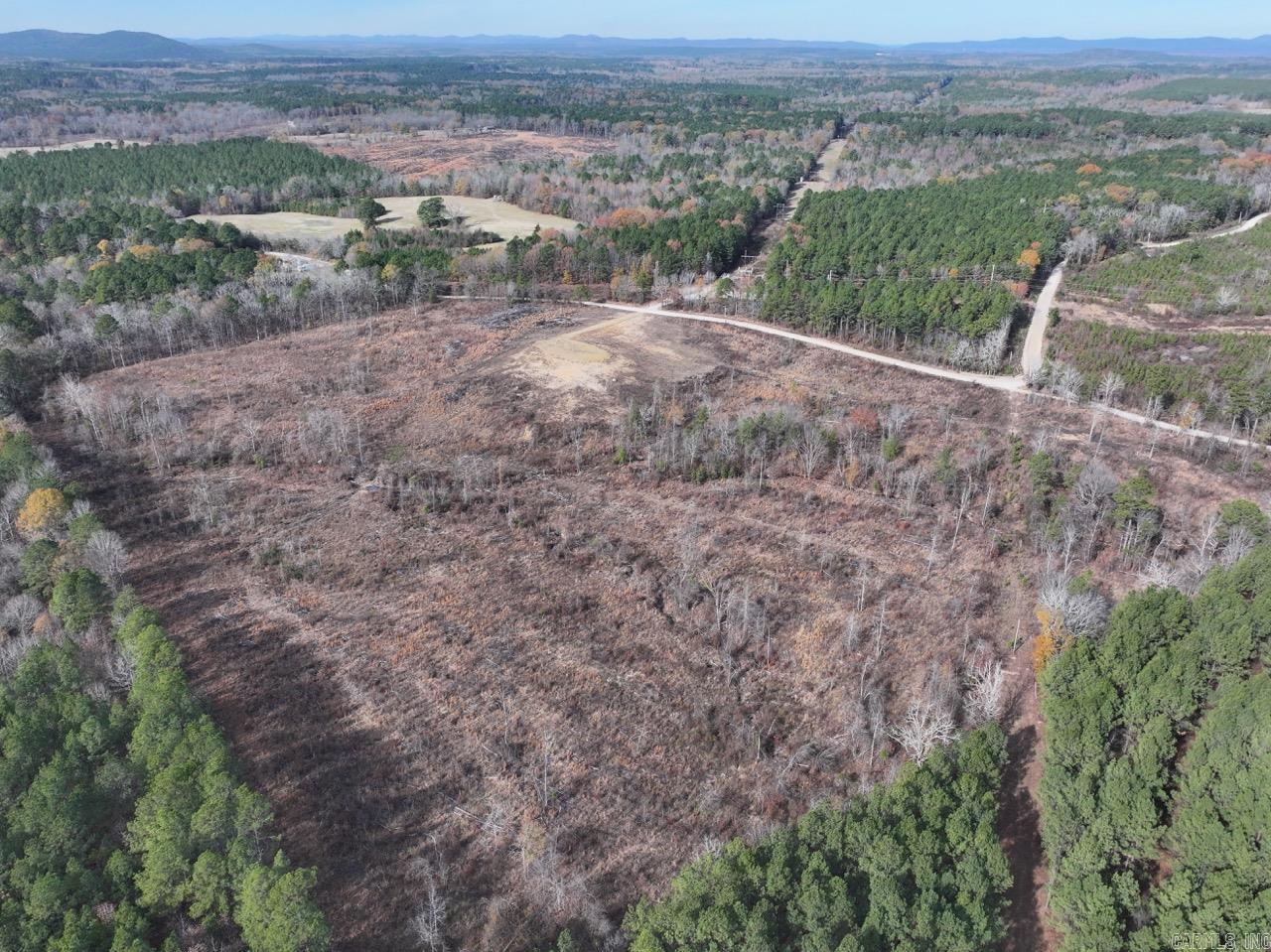 33 acres. House pad in place. Water & electric at road. Perc test certificate. Survey.