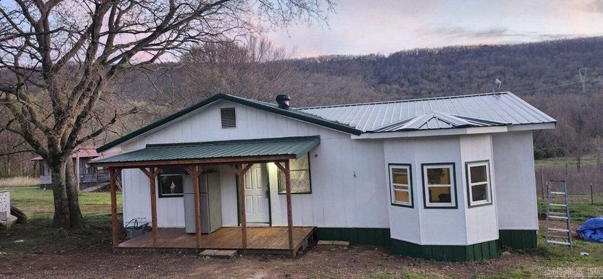 Have you ever dreamed of your own private little homestead? Here's one already set up for you! A little over two acres with 3 bedroom, 1 bath home, fenced backyard, with remaining land fenced for livestock. The pasture has been used for goats by current owners. The home features new flooring, plumbing, and electrical Nov. 2023, new water heater Oct. 2023, new metal roof Aug. 2023, and new electric fireplace and new LED lighting. Custom cabinets and cedar mantle. This property is completely set up for a homestead operation with beehives, rabbit hutches, and a small barn. There is also a 9 X 12 lofted workshop. Make this your own little piece of paradise!