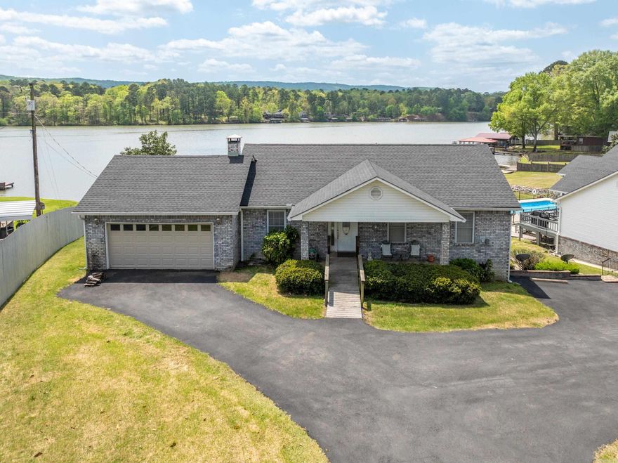 Welcome to this one of a kind lake house on the beautiful Lake Hamilton! This property boasts multiple opportunities. You can easily make this the 5 bedroom lake house of your dreams, or if you’re looking for an investment opportunity this property is turn-key ready for you to purchase and make the main house your own while renting the downstairs unit! Upstairs the main living space features a spacious open-concept layout with a cozy living room, fully equipped kitchen, and dining area overlooking the water. The master bedroom offers beautiful views of the lake with a private bathroom. Out back the large deck provides the perfect spot for outdoor dining or relaxing while taking in the picturesque surroundings! The second living space downstairs offers a similar layout with its own kitchen, living room, and two bedrooms, making it ideal for renting out or hosting extended family and friends. Don't miss out on this opportunity to own a piece of paradise on Lake Hamilton with the potential for rental income. Schedule a showing today and start living the lake life you've always dreamed of!