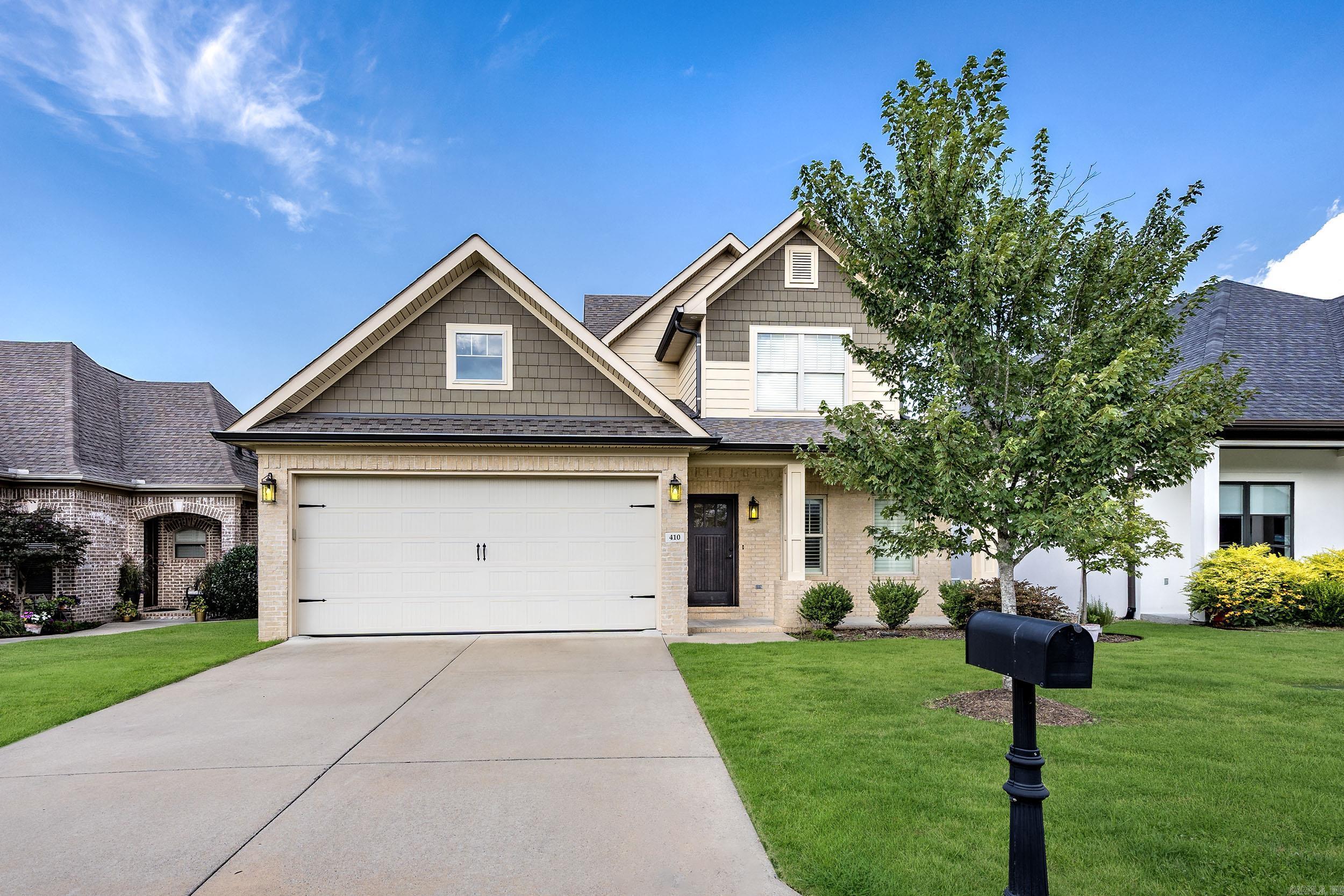 Welcome to 410 Wildcreek Circle in the highly sought-after Wildwood Place subdivision! This 4BR/2.5BA home offers a spacious and functional layout with thoughtful details throughout. The main-level primary suite features a coffered ceiling, spa-like bath with soaking tub, double vanities, and large walk-in closet. The inviting living room boasts a tray vault ceiling and cozy fireplace with gas logs, perfect for relaxing or entertaining. The kitchen features a gas cooktop, ample cabinetry, and opens to the dining area. Additional highlights include a drop zone with locker area, 2-car garage, and covered patio overlooking a level backyard with no back-door neighbors. Upstairs offers 3 generously sized bedrooms and a large shared bath. Donāt miss your opportunity to live in one of West Little Rockās most desirable neighborhoodsāschedule your private tour today!