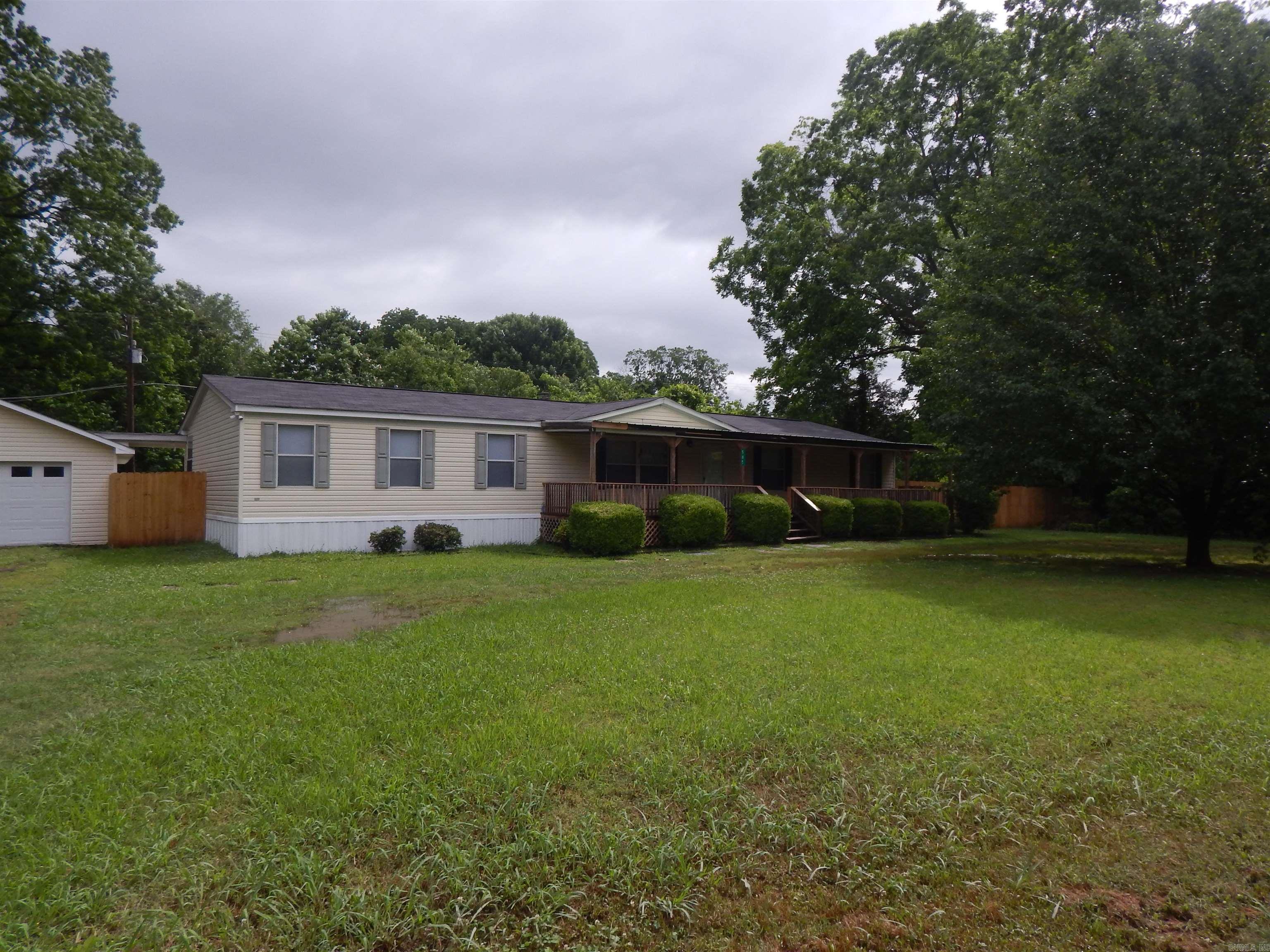 Wow! Lots of house and lots of updates. Little Red access is practically across the street. Great place to live or set up camp. Just down the road is the White River and Raft Creek duck hunting area. Almost all flooring recently replaced. Carpet in bedrooms and LVP through living areas. Fresh paint and light fixtures. Nice large front porch complete with porch swing and a nice big deck on back. Also has a 2 car garage/shop with new roll up door and opener. Privacy fenced back yard. Come see this great house at an affordable price today. This house is on a permanent foundation, title cancelled and affixed.