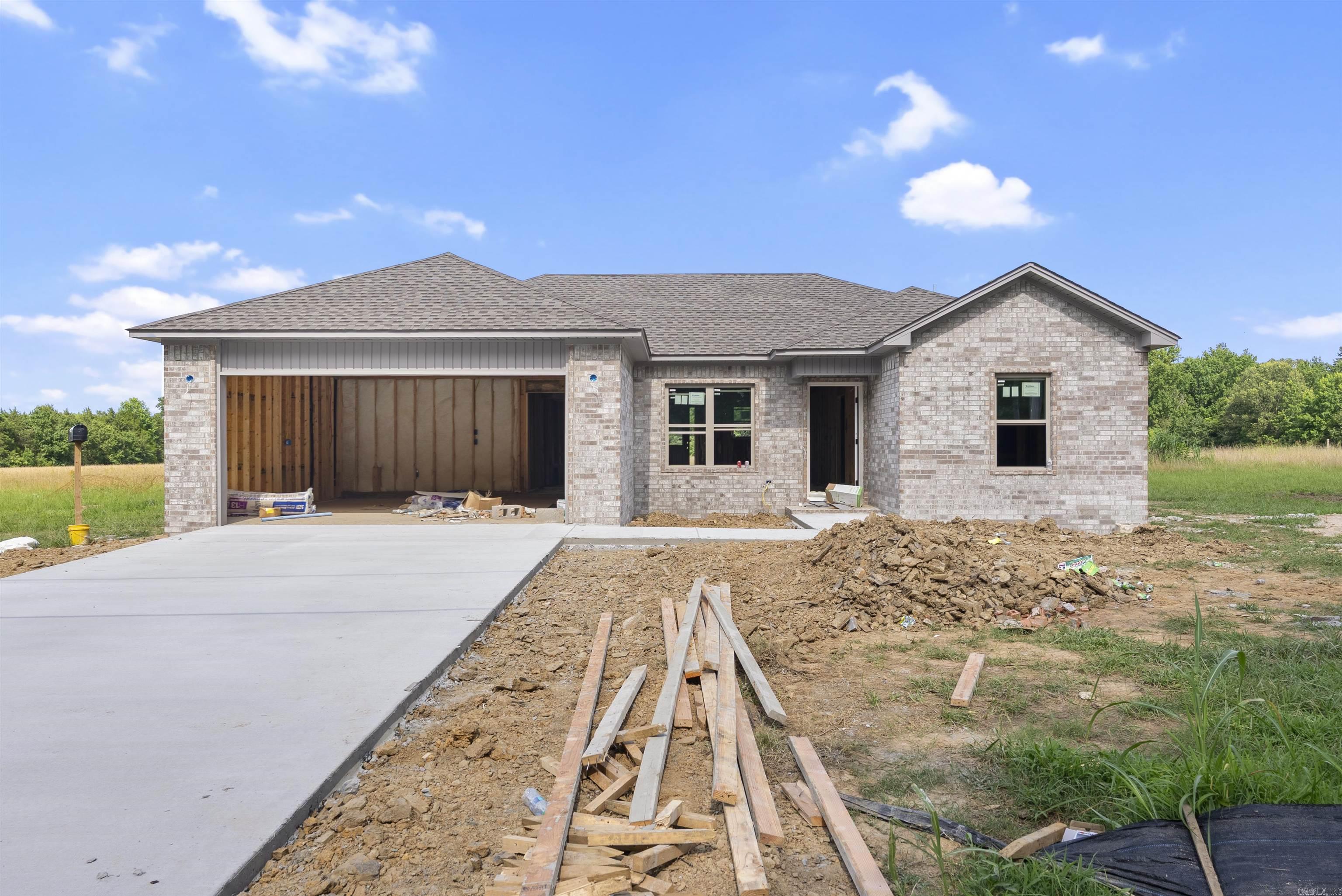 Welcome to this quality, new construction home built by Thomas Long Homes. This home features 3 bedrooms, 2 bathrooms, vaulted ceiling, open concept kitchen/dining/living, and a covered back porch. Estimated completion is around the middle of August. The interior will feature luxury vinyl plank floors throughout, tile shower in primary bath, granite countertops, and more! Minutes from I-57 and close to Highway 319, these homes are great for anyone working in Cabot, Beebe, Little Rock, Conway, or Searcy. We can't wait for you to make this your new home! Agents, please see remarks.