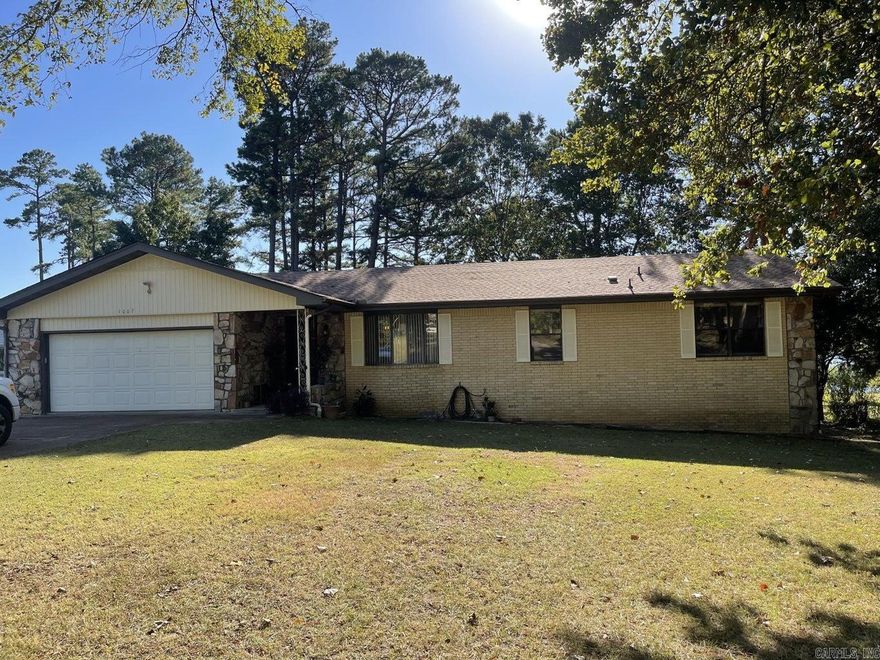 Crown lake home with gorgeous views from every window!! This 3 bedroom, 2.5 bath brick home has over 100 ft of lake frontage. This home features a large open living area with a gas fireplace, kitchen and pantry, formal dining/ sitting room, master suite, spacious guest bedrooms, and a large dedicated laundry all on the main floor. The screened in back porch is the place to be drinking coffee with the fabulous views of the lake! The walk out basement has extra living area, a separate area where current owners are using as a bedroom, a large workshop, & patio area with easy access down to the lake & dock! Recent survey with stakes in place.