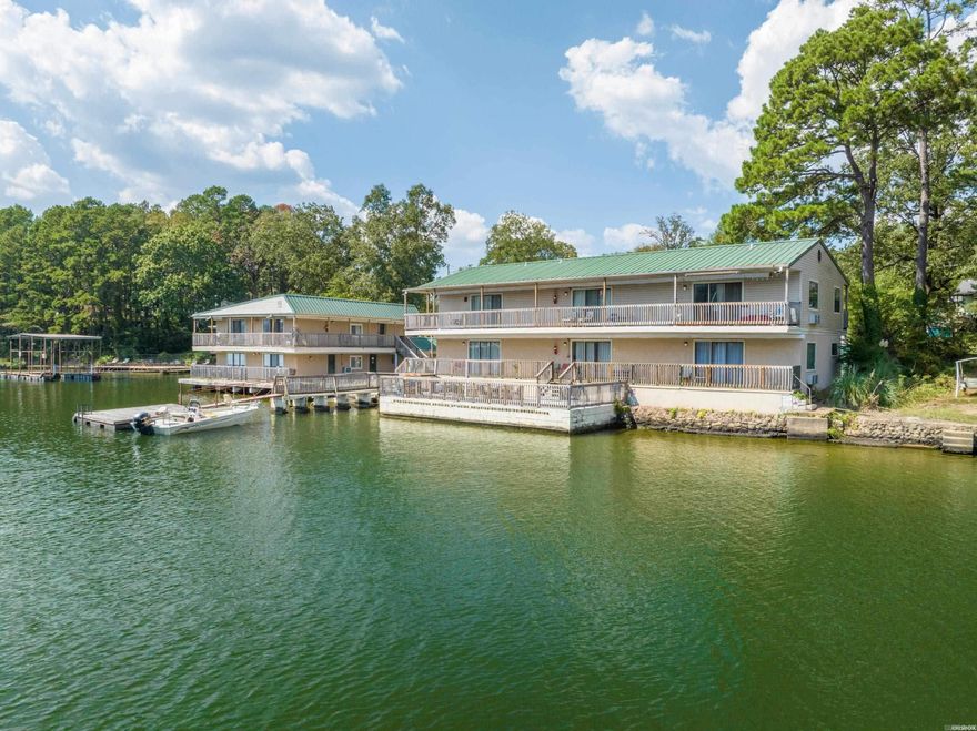 Very rare opportunity to own a 14 unit motel on Lake Hamilton! This one acre lake property boasts 14 charming rental units, along with a unique, historic home built in 1898!  This former apartment complex has been totally revamped into a charming short term rental complex.  The current owner has made lots of updates throughout the property to meet current short term rental codes. STR permits have been obtained for each of the units. A brand new fire suppression system has been installed throughout the facility.  The property has private boat ramp, and Entergy may approve construction of additional boat slips. There is potential to add lots of additional value by converting all of the units to Airbnbs, remodeling the home and/or constructing additional rental units on the property.