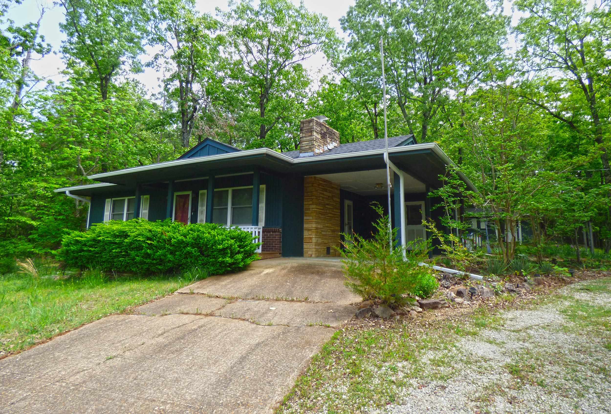 Two Bedroom Cottage Home on 2 lots. This home has 2 bedrooms, 1 & 1/2 baths, spacious kitchen with granite countertops, living room with a fireplace and hardwood floors throughout, a 13' X 14' bonus room with a wood stove that would make a great family room. Carport and storage building out back that could be a great work shop or she shed. Great Location!