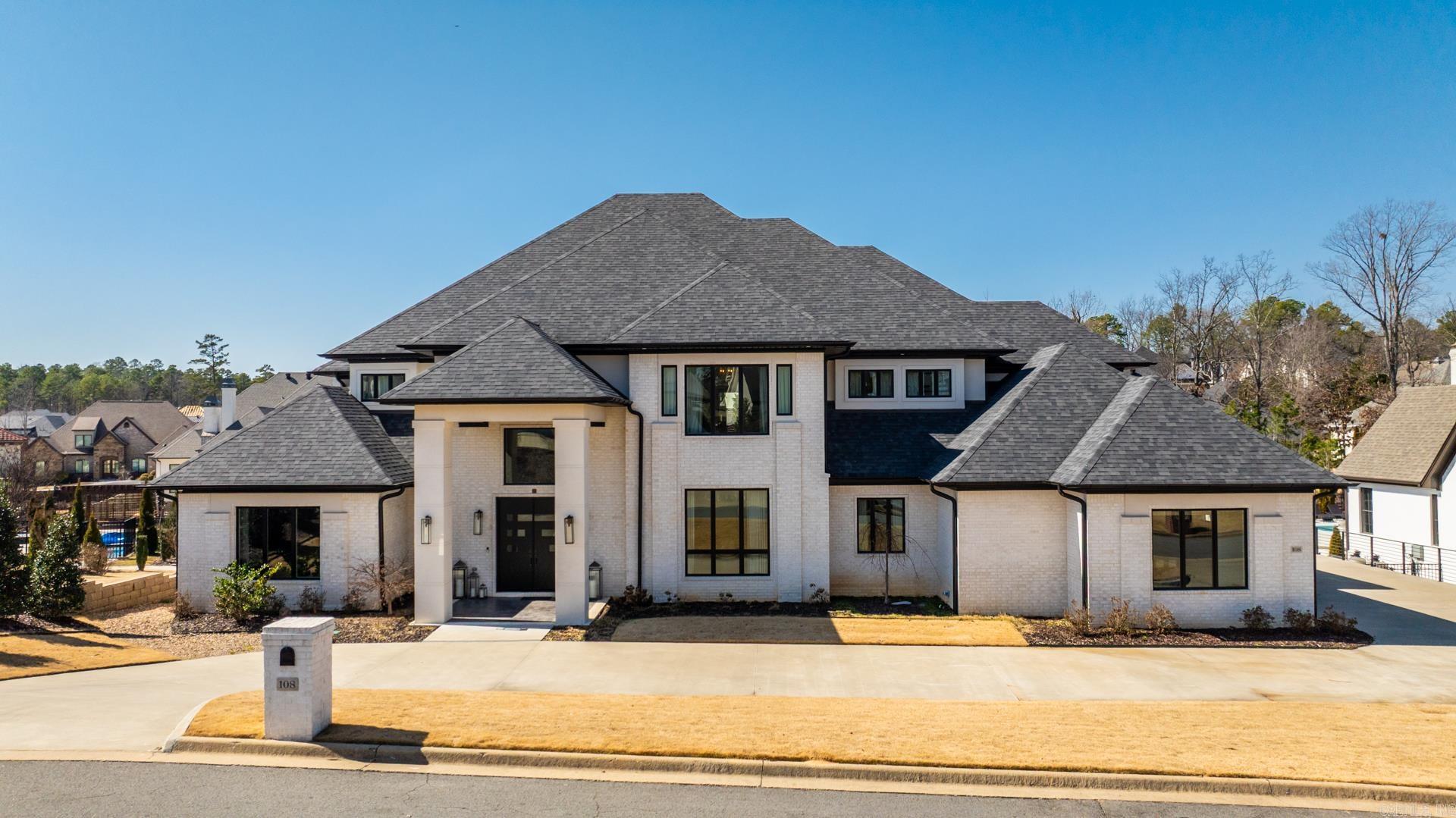 Video Tour: https://youtu.be/eNtt5P3hTOs Luxury living in the prestigious, gated Orle neighborhood of Chenal Valley. Exceptional craftsmanship & designer finishes at every turn. Spanning 5 bedrooms, each w/its own private en-suite, plus 2 additional half baths, home office with unmatched sophistication. Highlights include dedicated office, state-of-the-art theater room, versatile bonus room, & well-appointed mudroom. The entry greets w/grand floating staircase & dramatic great room w/custom built-ins, cozy fireplace, & remote-controlled window treatments. Gourmet kitchen is a chefās dream, with top-of-the-line Monogram appliances, Wolf built-in coffee/espresso maker, thick marble countertops, wet bar, & sleek white oak cabinetry. Primary suite is an opulent retreat, with a fireplace, wet bar, & spa-inspired bathroom. Indulge in the soaking tub, digitally controlled shower, heated tile floors, & custom walk-in closet. Exterior has beautiful tiled porches, covered outdoor kitchen, & sprawling double lot backyard primed for pool or expansive garden. Interior designed with RH furniture & lighting, 12 LED TV's, 5 sonos speakers throughout. All Furnishings negotiable. BAC: yes