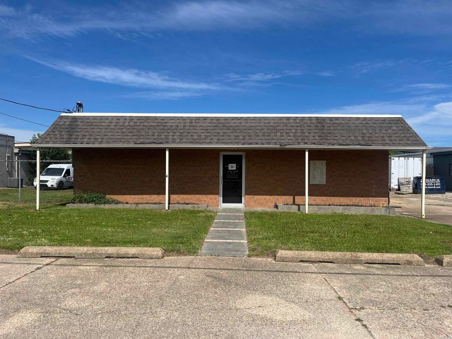 Versatile commercial property with two distinct business spaces on Falls Street—ideal for an owner-occupant, investor, or expansion opportunity. The front 800 SF unit is a C-1 zoned office building featuring steel canopies, chain-link fencing, and over 5,000 SF of reinforced concrete paving. Behind it sits a spacious 5,100 SF warehouse, perfect for storage, distribution, or light industrial use (S-1). Both sections are single-story with an effective age of 25 years. Convenient layout, multiple use options, and valuable infrastructure already in place.