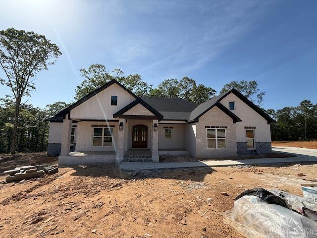 Over one acre Lakefront Lot! Enjoy the views of the lake from the big covered back porch with a vaulted tongue & groove wood ceiling. A large deck will be added for even more outdoor entertaining space. There will be room in this backyard if you wanted to add a pool later. The home is open concept with cabinets in the kitchen to the 10 ft. ceilings. The pantry is huge & will be hidden behind the cabinet doors in the kitchen cabinets. Will have a massive island with the sink in the island. The living room has a vaulted ceiling that carries out to the back porch. You will love the windows with the views of the lake. The laundry is oversized with lots of cabinets. From the laundry room you can enter the primary closet with more room than you will have clothes for. From the closet you can enter the primary bathroom. Separate tile shower & soaking tub and dual vanities. Primary bedroom is separate from the 3 guest bedrooms. Luxury vinyl flooring throughout. Lockers as you come in from the garage. The 3rd bay of the garage is extra deep (35 feet) to stow all of your lake toys and your boat. There is also room on this lot to build a shop. This subdivision is brand new. All new homes here