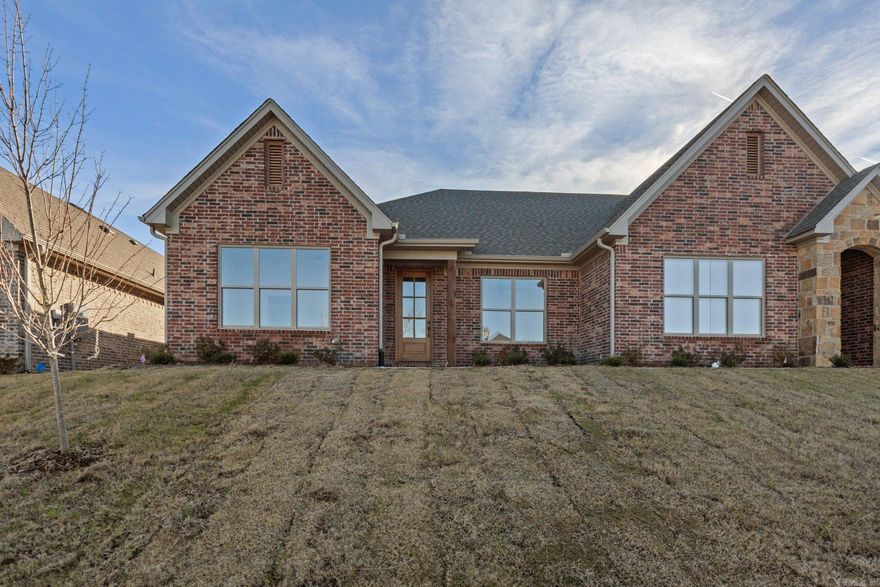 Welcome to Edgewood, West Little Rock's newest destination for luxury living! Nestled amidst lush landscaping and mature trees, this community offers a tranquil, secluded setting while keeping you just minutes from top shopping and dining destinations. One of the best perks? You'll never have to mow your lawn again! Lawn maintenance is included in your annual fees. This stunning HD HOMES built attached patio home boasts an open-concept layout with designer finishes throughout. It features a private owner's suite with a spa-like bathroom, a guest bedroom, and a versatile bonus room perfect for a home office, playroom, or anything you envision. The chef’s kitchen, complete with a large center island, seamlessly flows into the spacious living area, which includes a beautiful electric fireplace. Each home is separated by fire walls with soundproofing to ensure a peaceful, quiet environment. And for the ultimate in comfort and relaxation, the back porch is an absolute must-see. As an end unit, it offers additional privacy, making it the perfect place to call home! Set to be complete in September 2026.