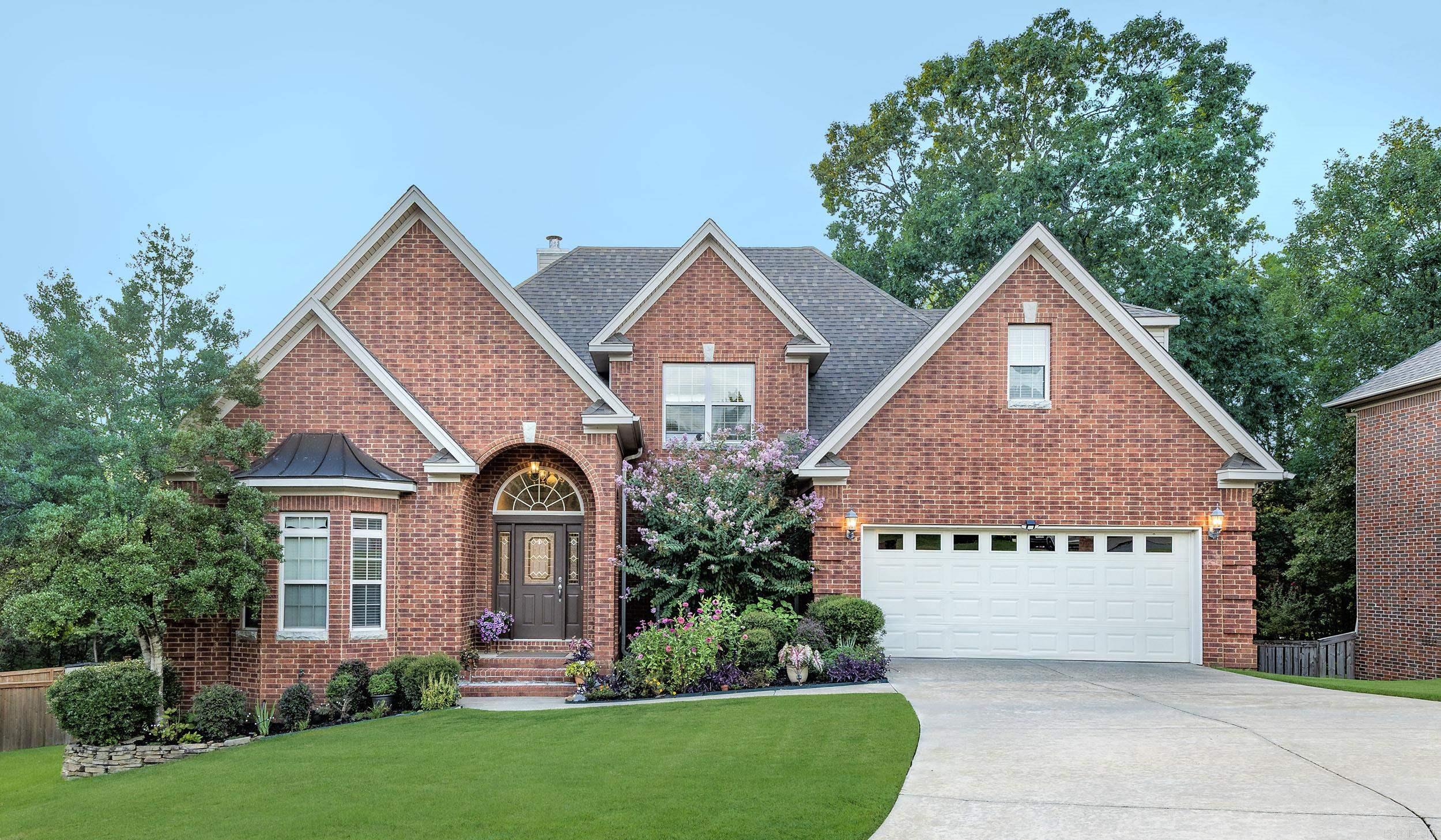 This elegant 4-bedroom, 3-bathroom home is tucked away on a quiet cul-de-sac. It features a spacious and open floor plan with vaulted ceilings and abundant natural light. The main level includes two bedrooms and two bathrooms for added convenience. The modern kitchen provides ample counter space and connects seamlessly to the living areas, including a cozy fireplace. The upstairs bedrooms are thoughtfully designed, with a luxurious primary suite offering a private retreat. Enjoy the serene, wooded backyard, which is perfect for outdoor dining, relaxing, or gardening. The home is located in the desirable Villages of Wellington, a community with a pool, tennis courts, walking trails, and parks. You'll be just minutes from premier shopping, dining, and top-rated schools on Chenal Parkway while still enjoying a peaceful, suburban lifestyle. New roof in 2024!! See this one today!
