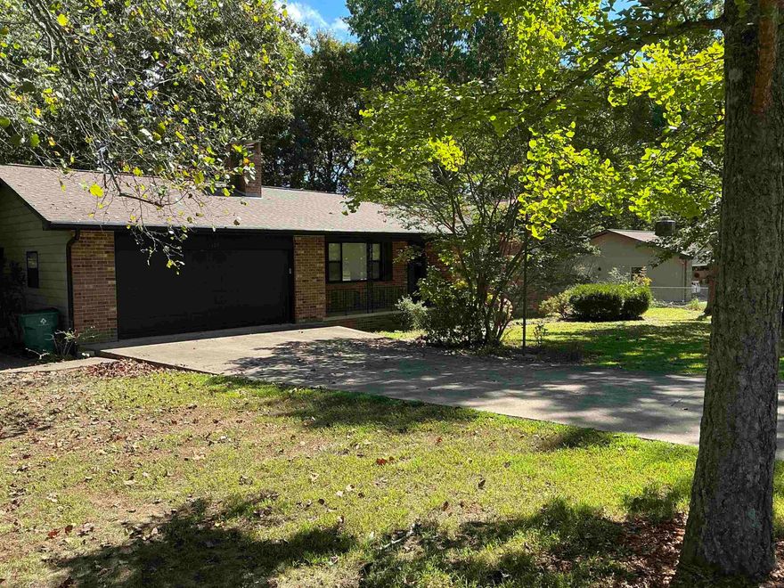 Escape reality in this quiet Fisherman’s Oasis getaway fully remodeled inside. Curl up to the wood burning fireplace and enjoy a movie as you observe the native wildlife outside All new flooring, carpet, LVP and Tile, 2” Blinds throughout, new HVAC, programmable thermostat, new water heater, new paint, ALL new lighting and plumbing fixtures. Garage will house a 21’ bass boat with breakaway tongue. 5. Minutes from trout fishing and 5 minutes to the boat ramp to bass fish. The sunroom is 20 x 20 surrounded by floor to ceiling windows to allow nature in. 3 bedrooms and 2 baths home. Lose yourself in the quiet atmosphere and relax.