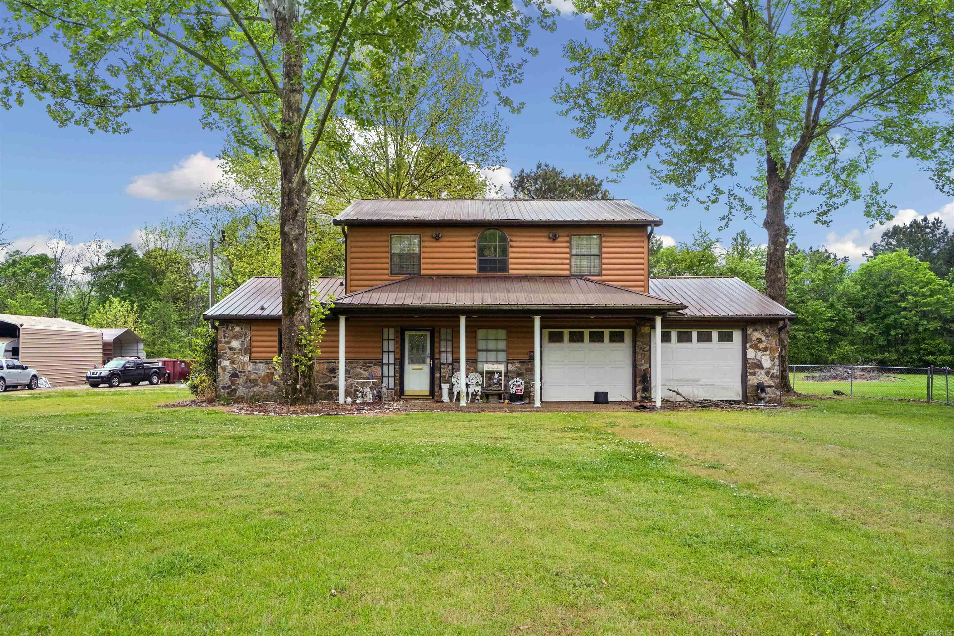 Well maintained 2,475 sq ft, 4 bed 2.5 bath home with multiple shops/storage buildings/RV storage minutes from LRAFB and area amenities. Home features log cabin looking exterior, storm shelter, large fenced yard and outdoor space to relax or to entertain. Recent updates include new paint in several areas, new HVAC system, updated appliances and primary suite recently remodeled and modified to be handicap accessible.