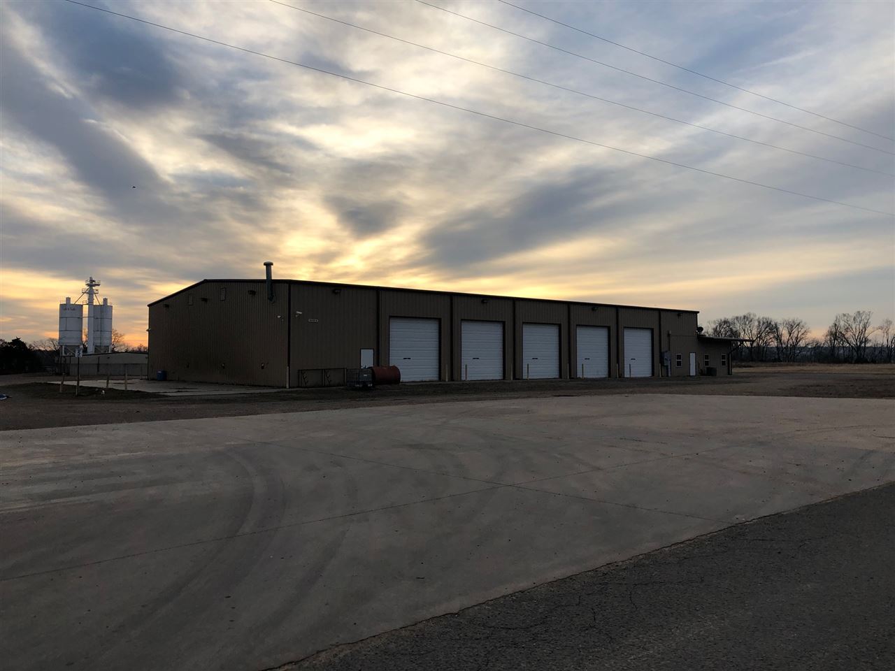 Two Buildings on Ten Acres of Ground which was used for a Trucking Company and a Sand and Gravel Company. Sand Plant is 20,131 sq ft per tax card includes silos, scales, scale hosue, wash bay, and offices. The other building is 12,800 per tax card was used for a trucking company, Building has five bay doors and eight offices five bathrooms and upstairs area for office or training.