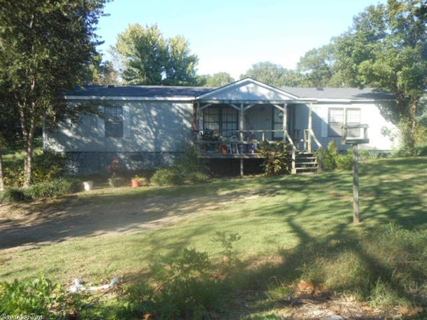 1996 Doublewide on 2.390 acres, additional older home, value in land.