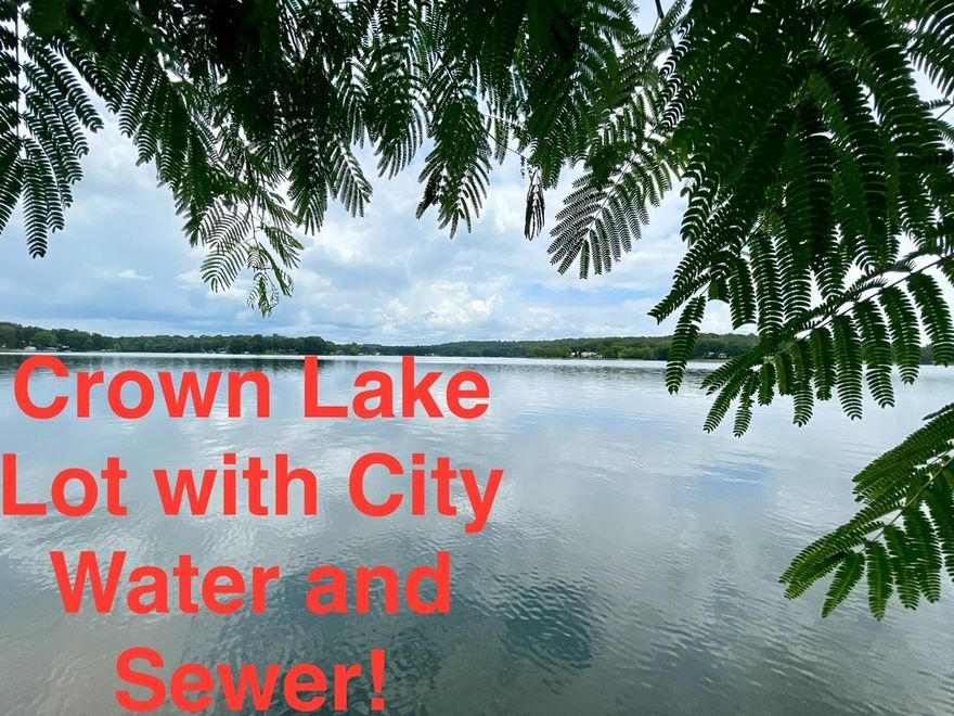 Lakefront Living Awaits at 300 Isabella Lane, Horseshoe Bend, AR – Crown Lake Lot!  Imagine waking up each morning to breathtaking views of sparkling water and tranquil surroundings—your dream lake life starts here! This prime Crown Lake lot offers .45 acres m/l with 120 feet of beautiful flat rock shoreline, making it an ideal spot to build your dream lake home or getaway retreat. Enjoy deep, clear water perfect for swimming, kayaking, and especially excellent fishing—no weeds, no hassle.  Located directly across from the Crown Lake Resort and Campground, this lot gives you front-row access to one of Horseshoe Bend’s most scenic spots. Crown Lake spans approximately 640 acres with over 22 miles of shoreline, offering endless opportunities for boating, fishing, and water recreation in a peaceful Ozark Mountain setting.  City water and sewer are already available, and new owners may build a dock up to 32 feet, adding incredible value and convenience. Whether you’re looking for a weekend escape, investment property, or future retirement spot, this lakefront gem is ready for you.  Don’t miss your chance to own a piece of paradise on Crown Lake—schedule your showing today!