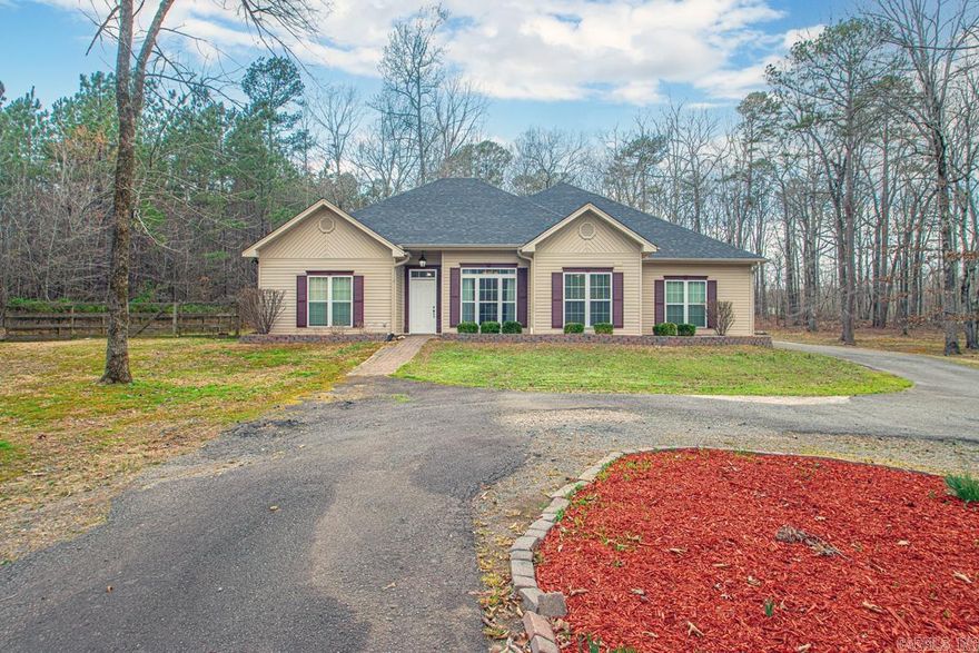 Welcome to 9749 Springhill Farms Drive! Come enjoy the perfect blend of privacy and convenience with this spacious 4 bedroom, 2 bath home situated on 3.38 acres just minutes from town. This home features a desirable layout with the primary bedroom set apart for added privacy and a separate dining room ideal for gatherings and entertaining. This beauty is set back from the road with a long driveway providing a peaceful setting and great curb appeal. Outside you'll find plenty of room to spread out along with a covered patio, 24x20 shop with electricity- perfect for hobbies, storage, or a workspace. Roof replaced 3 years ago and HVAC replaced 2 years ago. Bryant School District!! Schedule your showing today!!!