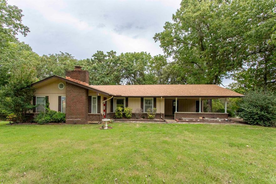 Country Home on Oversized Lot in Cherokee Village. nice back deck. Shop in the walkout partial unfinished basement. Welcome to 1 Paracas Trace, a lovely 3-bedroom, 1.5-bath home on nearly an acre (0.89 acres) in beautiful Cherokee Village. This home offers a warm and inviting atmosphere, with a practical layout and plenty of room to make it your own. Recent architectural shingled roof replacement. New water heater. Full septic inspection and upgrades in 2021. Convenient location to the south entrance to Cherokee Village. Private w/ Trees surrounding property. The property includes a 2-car carport for covered parking and storage, while the oversized lot provides endless possibilities—whether you want space for outdoor entertaining, or simply a private place to relax. Living in Cherokee Village means enjoying an active lifestyle with 7 lakes, 2 golf courses, community centers, swimming pools, and scenic walking trails right at your fingertips. Primary residence, a weekend getaway, or a rental investment, this home offers a great blend of value and location. Don’t miss the chance to own a piece of the Ozarks in this peaceful and amenity-rich community!  "Subject to court approval"
