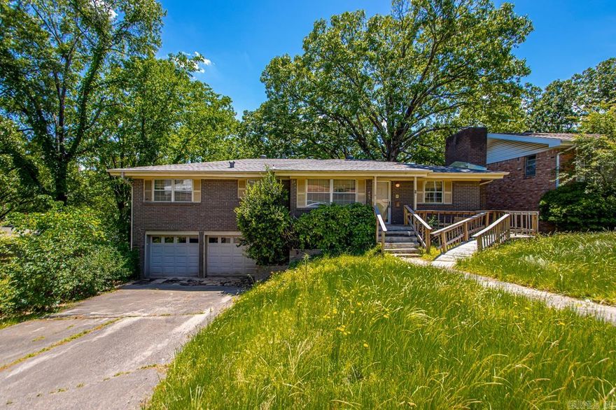This split-level home in the established Crosswinds subdivision offers a fantastic opportunity for investors or owner-occupants ready to add value and make it their own. With three bedrooms on the main level, a flexible layout featuring both a great room and a family room, and a functional eat-in kitchen with a breakfast bar, there's plenty of space to work with. The home includes a two-car garage, central heat and air, and bonus features like a wood-burning fireplace, laundry area, and a mix of laminate, vinyl, and luxury vinyl flooring. Outside, you'll find a sloped lot with extra landscaping, a deck, patio, and front porch—perfect for future outdoor updates. Whether you're looking for a solid rental, a renovation project, or a home to customize and live in, this North Little Rock property is worth a look. NEW ROOF MARCH 2025!