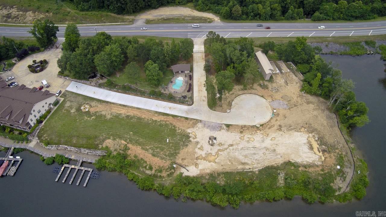 Attention Developers - opportunity for five building sites on 641' of Lake Hamilton frontage! Beautiful Southern and Western views across wide channel of Lake Hamilton. Gated, upscale residential community to build your dream home. Building restrictions and architectural control. Utilities underground. Residences share use of common area in-ground pool. POA includes private sewer treatment charges. Entergy Hydro guidelines allow for more facilities.