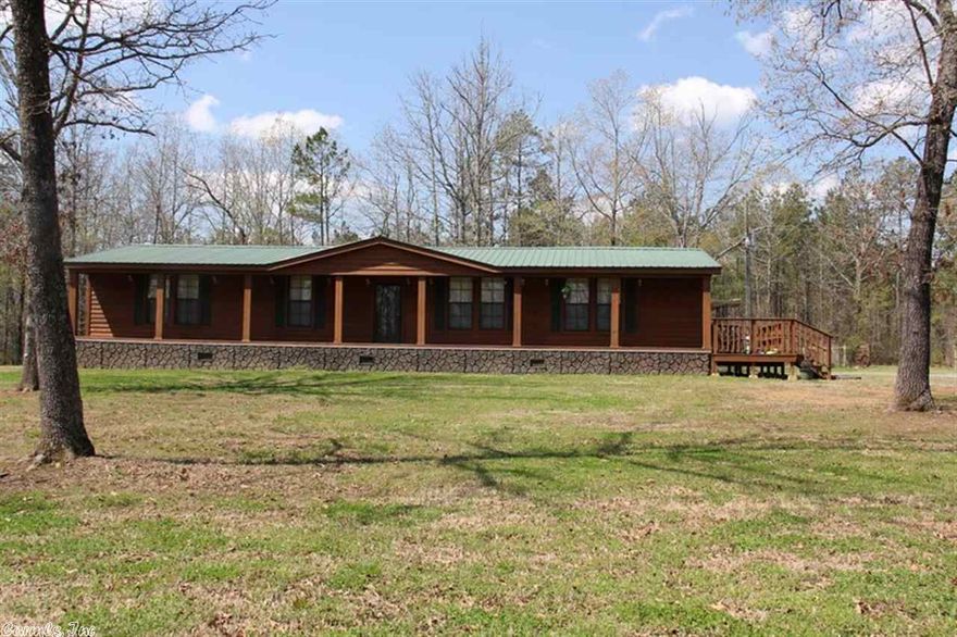 Just 3.5 miles from Scotland this large home has plenty of space indoors & out.  Open floor plan w/ kitchen island, pantry, gas fireplace, formal dining room, master BR & bath w/ double vanities, walk-in shower & soaking tub. Front/rear covered porches & carport.  30x40 metal shop bldg. w/ concrete floor, roll up door, elec/water.  Room for livestock or hunting deer, bear & turkey seen on the land.  Approx .75 miles from Gulf Mtn Rec Area & approx. 5 miles to Ozark Nat Forest.  Mtn views & lots of privacy.