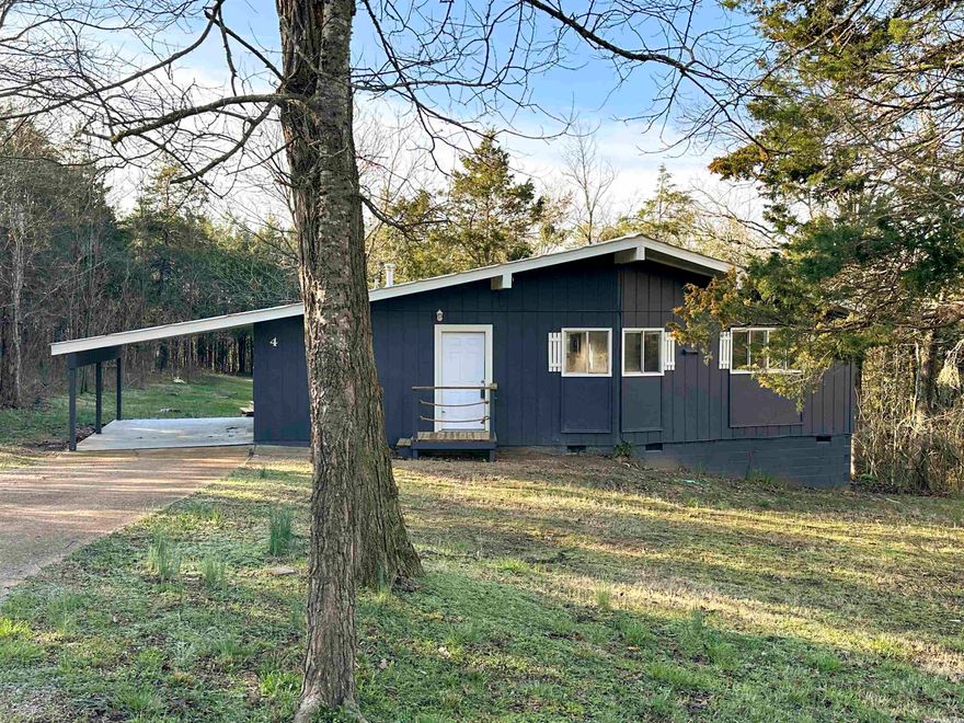 Located on a quiet cul-de-sac within minutes of local amenities such as lakes, rivers, and golf courses, this recently renovated 3 bedroom, 2 bathroom home is nestled in the woods of the Ozark Mountains on a level and serene yard.  Freshly painted on both the interior and exterior, this home with a beautiful open concept has been given a dramatic cosmetic facelift from the vinyl plank flooring throughout, to the brand new stainless steel appliances, to the remodeled bathrooms and more!  You will truly enjoy the privacy and nature from this newly constructed back deck!  You will want to act quick on this great deal!  Settings and locations like this don’t come around every day!