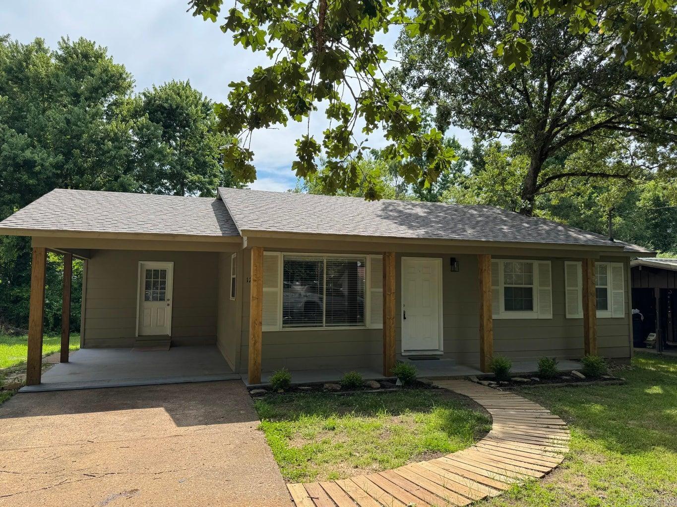 Super cute and nicely updated 2 bedroom 1.5 bath home. The curb appeal on this house welcomes you right into the open floor plan living room and kitchen. Home features a dedicated laundry and half bath, along with good storage. Extra storage or workshop attached to back of home. New roof in 2025 for peace of mind!