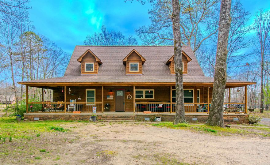 Wonderful country home on 1.47 acre lot.  Wrap around porch welcomes you to this 4 bedroom, 3 1/2 bath home.  Great room has wood burning site built fireplace.  Spacious kitchen has granite counter tops with breakfast bar and dining area with bay window.  Primary bedroom has very large closet and bath on first floor.  Extra bedroom has its own bath and is also on first floor.  Two bedrooms upstairs have Jack and Jill bath.  Floored attic space.  Front yard has large shade trees.  Blooming shrubs and bulbs will be showing their colors soon.  Back yard has an area of the yard fenced off.  Lot goes all the way to the street behind the house. If you are looking for country living, this is for you. Seller will give a flooring allowance with an acceptable offer.