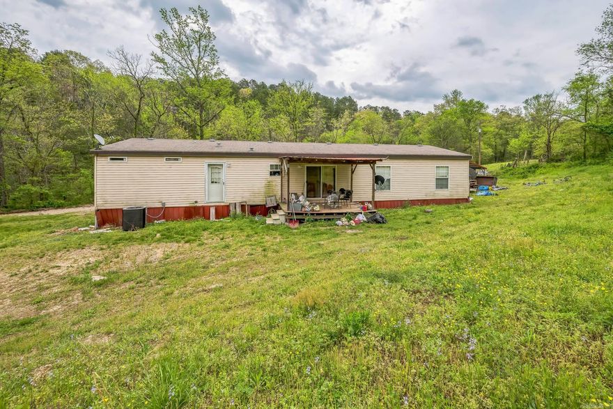 Spacious 4+ Bedroom Home on 5 Acres – Just 11 Miles from Mountain View, AR! This 1,680 sq ft mobile home offers 4 bedrooms, 2 full baths, plus a bonus room that could serve as a 5th bedroom, office, or hobby space. The land is a peaceful mix of woods and clearings, with plenty of space for gardening, recreation, or livestock. Several outbuildings provide storage or workshop potential.  Located near Mountain View—the Folk Music Capital of the World—you’re just minutes from the White River, Blanchard Springs Caverns, Slyamore Creek, and the Ozark Folk Center. Enjoy festivals, live music in the park, and a town full of charm, tradition, and friendly faces. Whether you're looking for a permanent home, weekend getaway, or short-term rental opportunity, this Ozark property has so much to offer!  https://mountainviewarkansas.com/ Schedule a showing now!!!